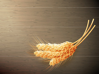 Image showing Wheat on wooden background. EPS 10