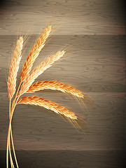 Image showing Wheat on wooden background. EPS 10 