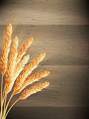 Image showing Wheat on wooden background. EPS 10 