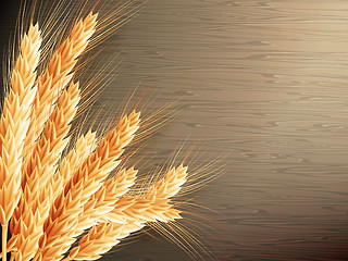 Image showing Wheat on wooden background. EPS 10 