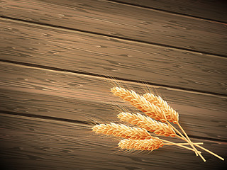 Image showing Wheat on wooden background. EPS 10 