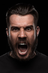 Image showing Portrait of young screaming man in studio