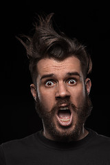 Image showing Portrait of young tousled man in studio