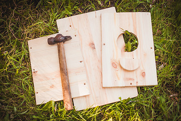 Image showing Birdhouse parts with hammer  