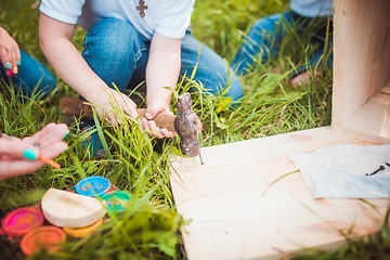 Image showing Happy family with Wooden birdhouse