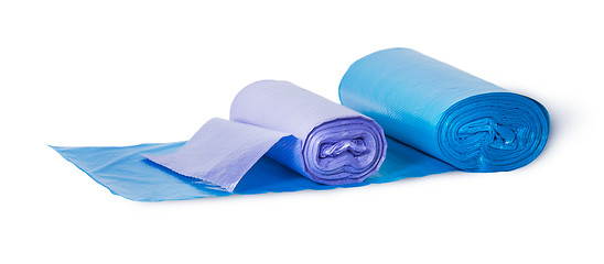 Image showing Blue and violet rolls of plastic garbage bags