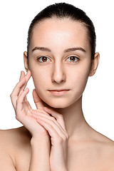 Image showing Portrait of beautiful girl stroking her face with healthy skin 