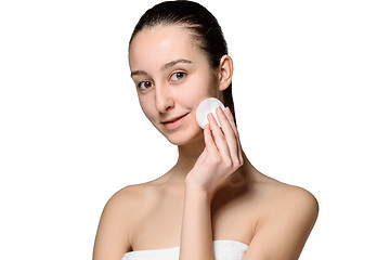 Image showing skin care woman removing face with cotton swab pad
