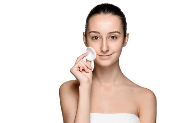 Image showing skin care woman removing face with cotton swab pad