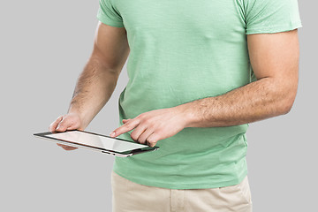 Image showing Man working with a tablet, 