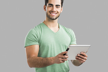 Image showing Man working with a tablet, 