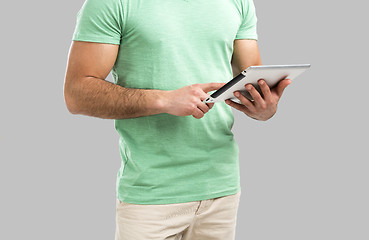 Image showing Man working with a tablet, 