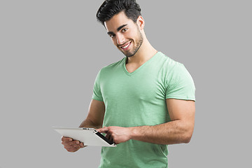 Image showing Man working with a tablet, 