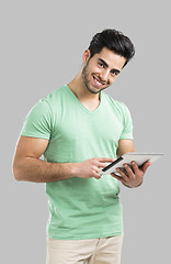 Image showing Man working with a tablet, 