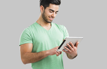 Image showing Man working with a tablet, 