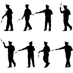 Image showing Set black silhouettes  Police officer  with a rod on white 