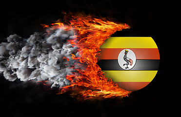 Image showing Flag with a trail of fire and smoke - Uganda