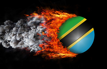 Image showing Flag with a trail of fire and smoke - Tanzania