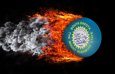 Image showing Flag with a trail of fire and smoke - South Dakota