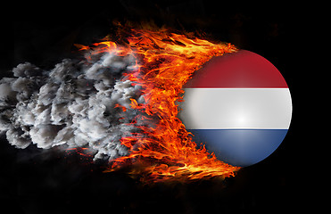 Image showing Flag with a trail of fire and smoke - Netherlands