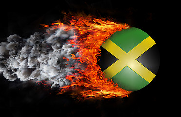 Image showing Flag with a trail of fire and smoke - Jamaica