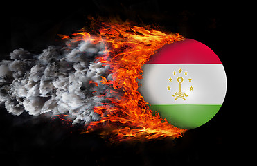 Image showing Flag with a trail of fire and smoke - Tajikistan