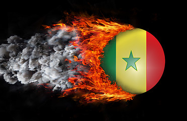 Image showing Flag with a trail of fire and smoke - Senegal