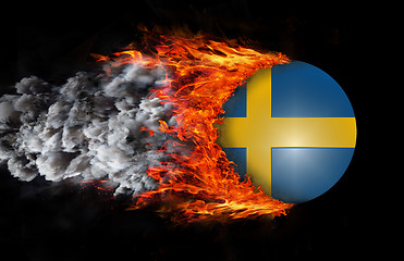 Image showing Flag with a trail of fire and smoke - Sweden