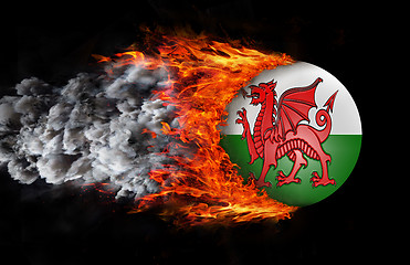 Image showing Flag with a trail of fire and smoke - Wales