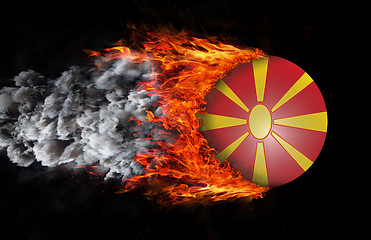 Image showing Flag with a trail of fire and smoke - Macedonia