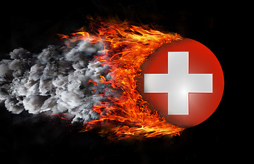 Image showing Flag with a trail of fire and smoke - Switzerland