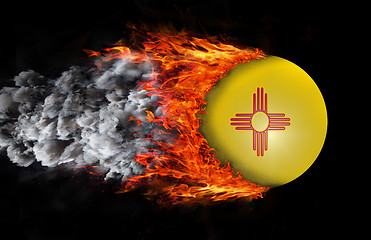 Image showing Flag with a trail of fire and smoke - New Mexico