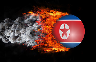 Image showing Flag with a trail of fire and smoke - North Korea