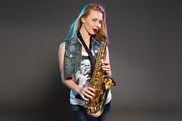 Image showing beautiful blonde as saxophonist woman 