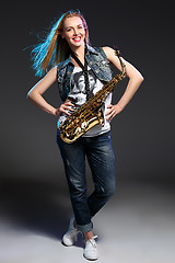 Image showing beautiful blonde as saxophonist woman 