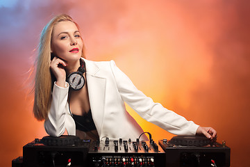 Image showing Beautiful blonde DJ girl on decks - the party,
