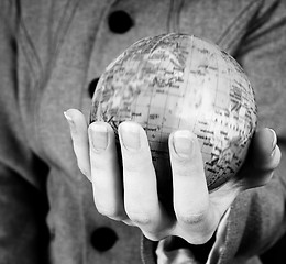 Image showing Globe in a girl\'s hands