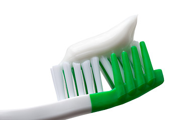 Image showing Green toothbrush with toothpaste isolated on white background