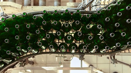 Image showing Many bottles on conveyor belt