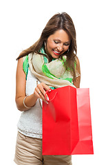 Image showing Fashionable Woman Looking Inside a Shopping Bag