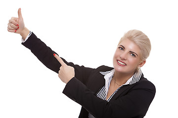Image showing Businesswoman Pointing Up While Looking at Camera