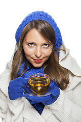 Image showing Fashionable young woman sipping hot tea