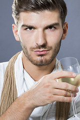 Image showing Sexy handsome man drinking white wine