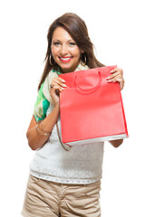 Image showing Fashionable Woman Looking Inside a Shopping Bag