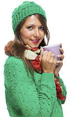 Image showing Pretty Woman in Winter Fashion Drinking Coffee