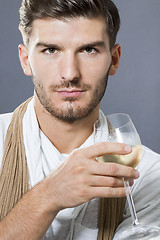 Image showing Sexy handsome man drinking white wine