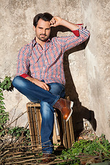 Image showing Male model sitting with legs crossed