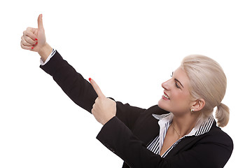 Image showing Businesswoman Pointing Up While Looking at Camera