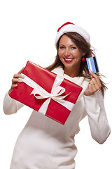 Image showing Woman holding a Christmas gift and bank card