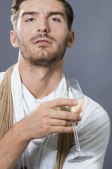 Image showing Sexy handsome man drinking white wine